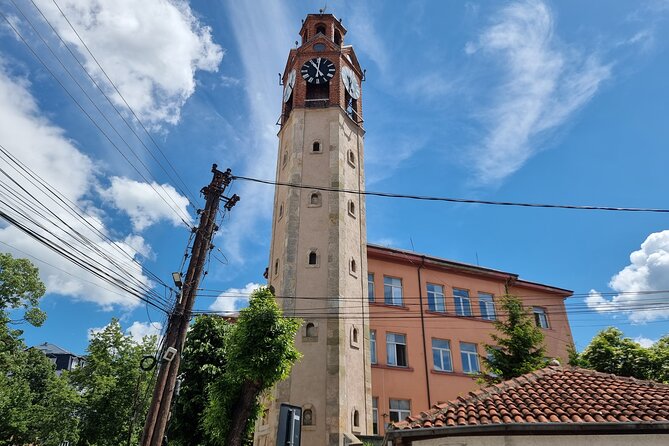 Prishtina Walking Tour to Mother Teresa Cathedral - The National Library of Kosovo: domes, steel mesh, and what it meant